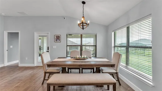 a bedroom with a bed a couch and a window