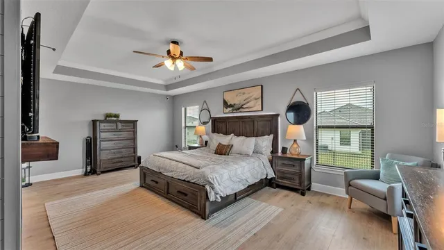 a bedroom with a bed and a television