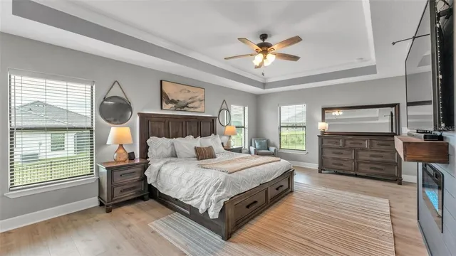 a bathroom with double vanity sinks a vanity and a large mirror