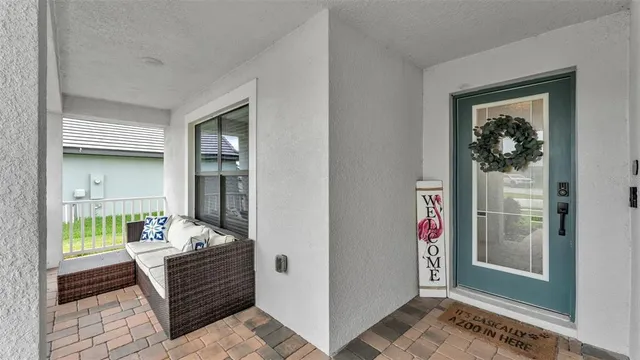 a room that has a couch and a dining table in it