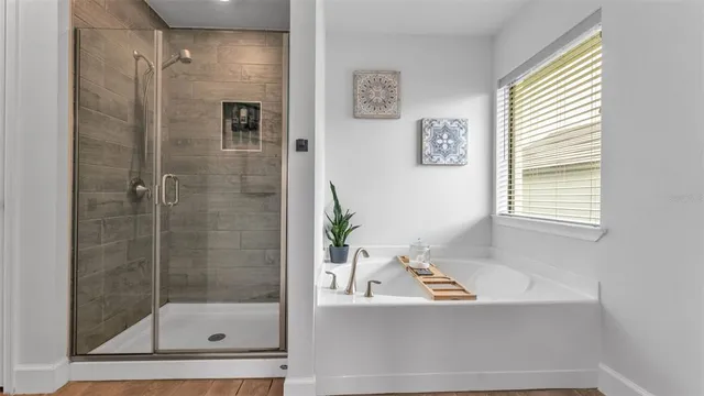 a view of walk in closet with clothes