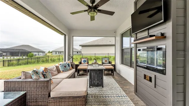 an aerial view of residential houses with outdoor space and swimming pool