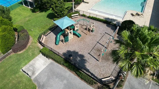an aerial view of residential building with outdoor space and lake view
