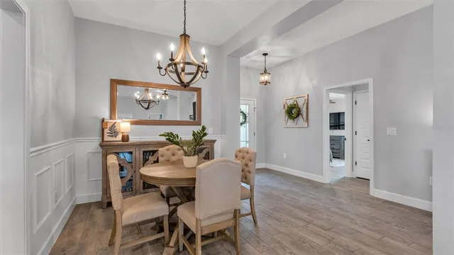 a living room with furniture a rug and a flat screen tv