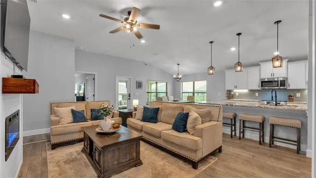 a living room with furniture and a flat screen tv
