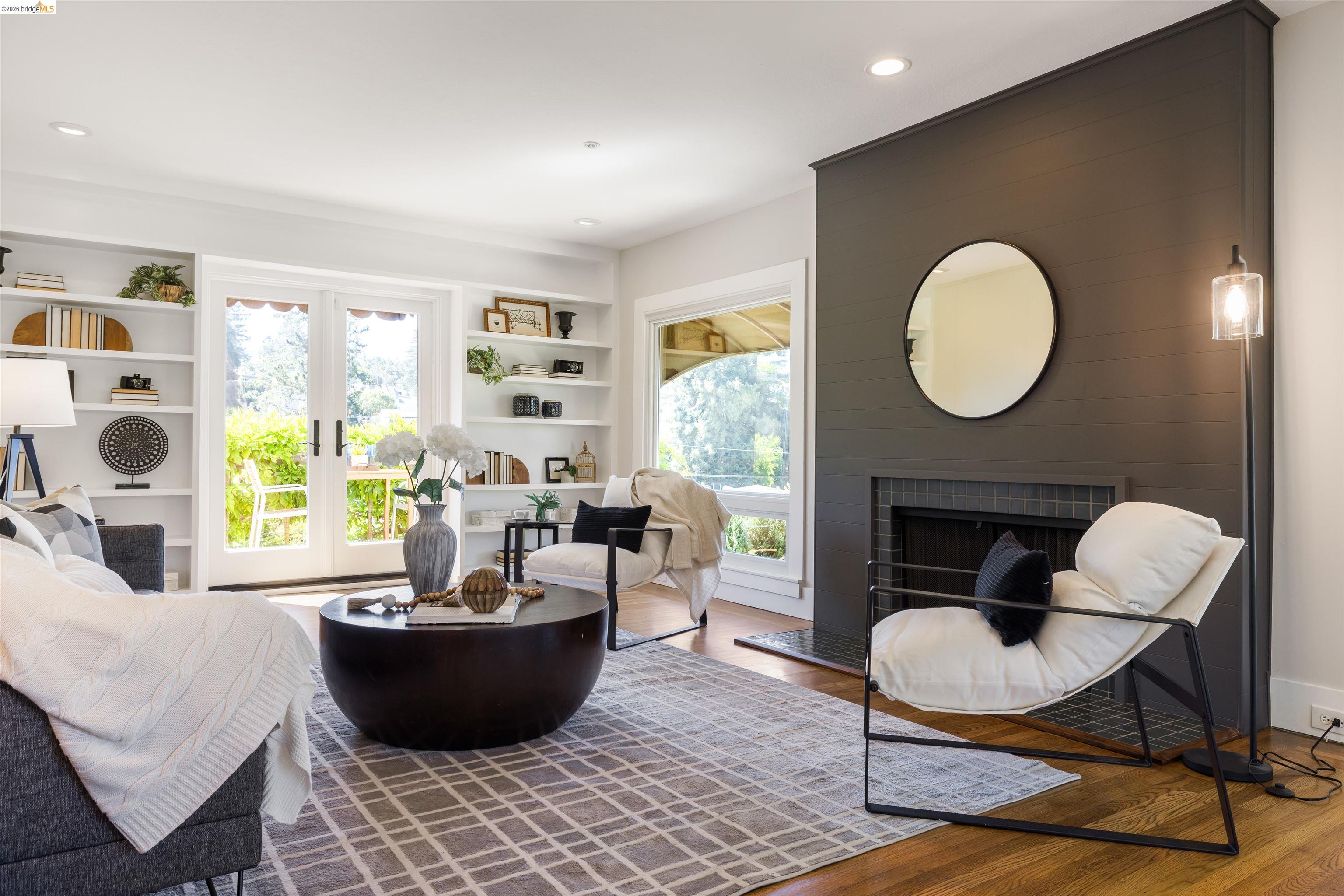 900 Euclid Avenue Berkeley, CA 94708 - Photo 8 of 54 a living room with furniture a fireplace and a large window
