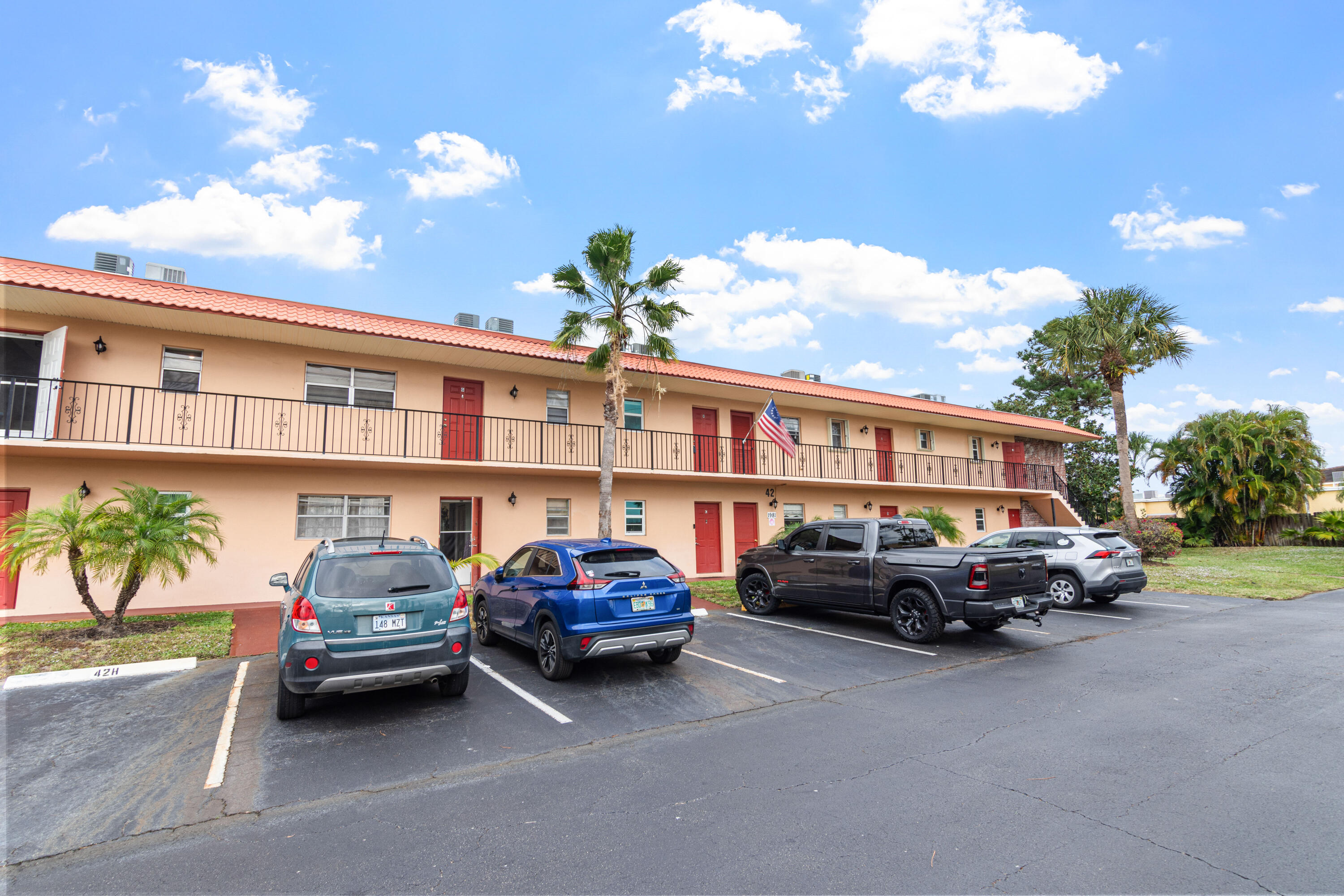 a front view of a house with parking space