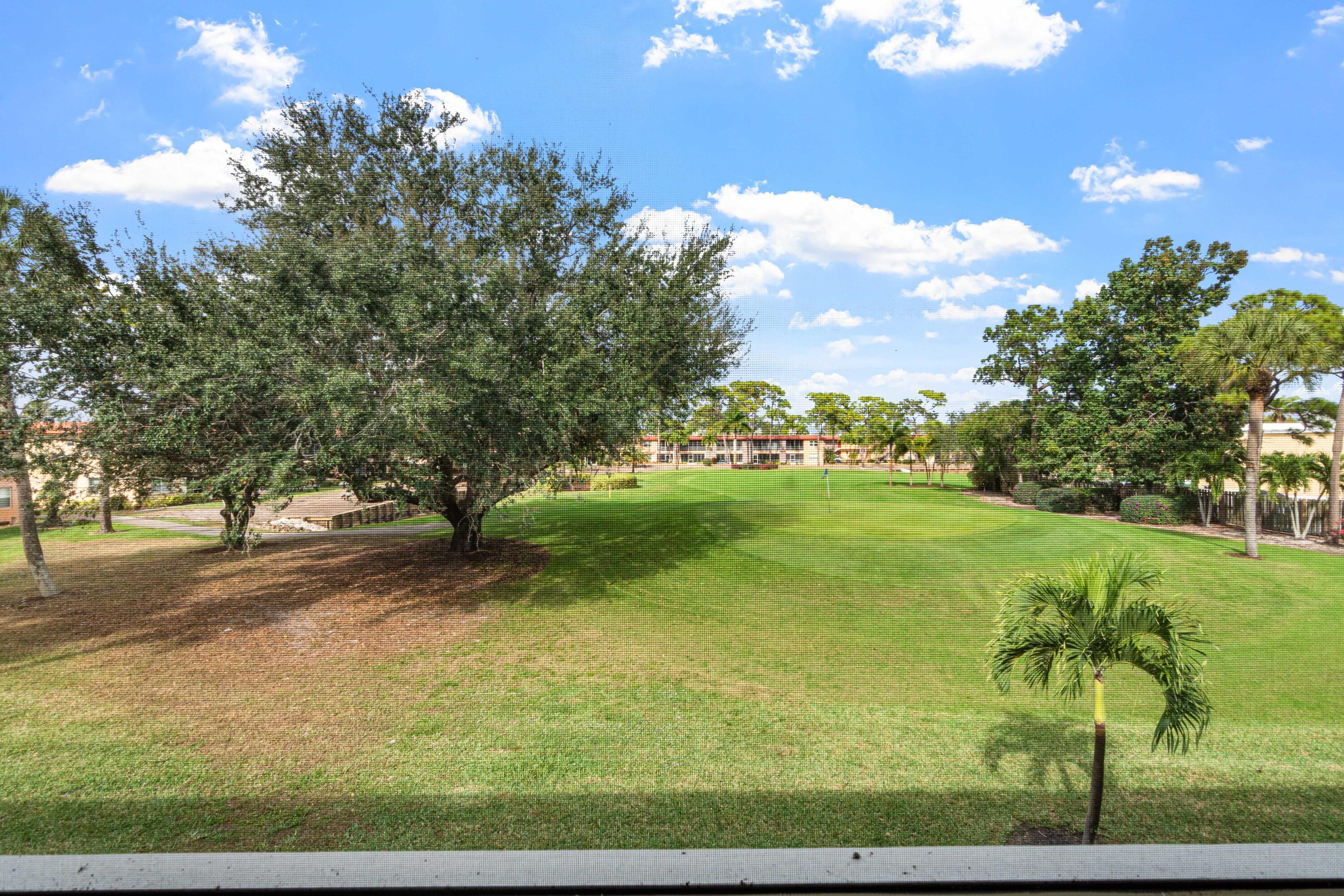 1981 Southwest Palm City Road, Unit 42H Stuart, FL 34994 - Photo 15 of 43 a view of an outdoor space and yard