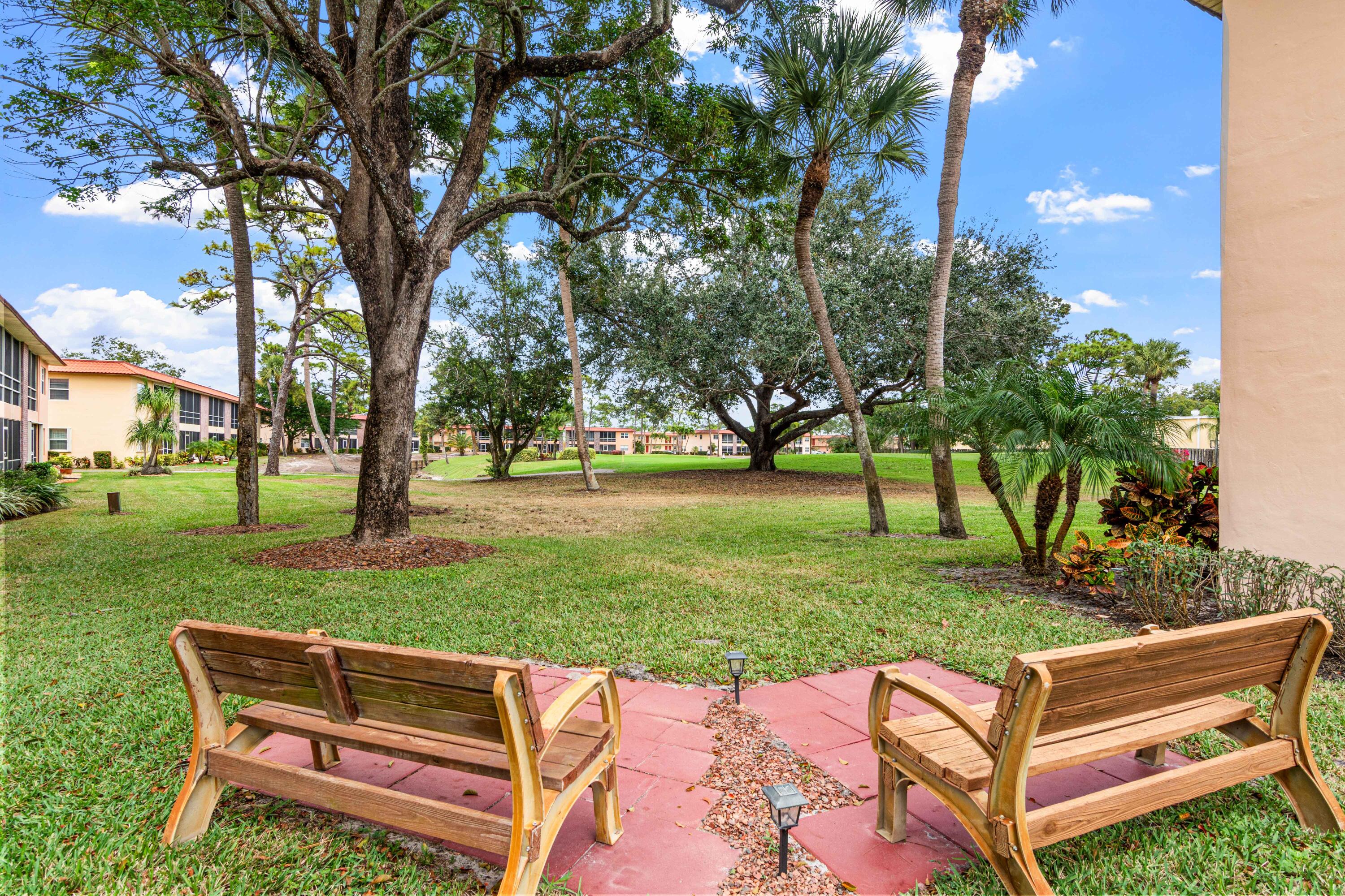 1981 Southwest Palm City Road, Unit 42H Stuart, FL 34994 - Photo 21 of 43 a view of a park with large trees