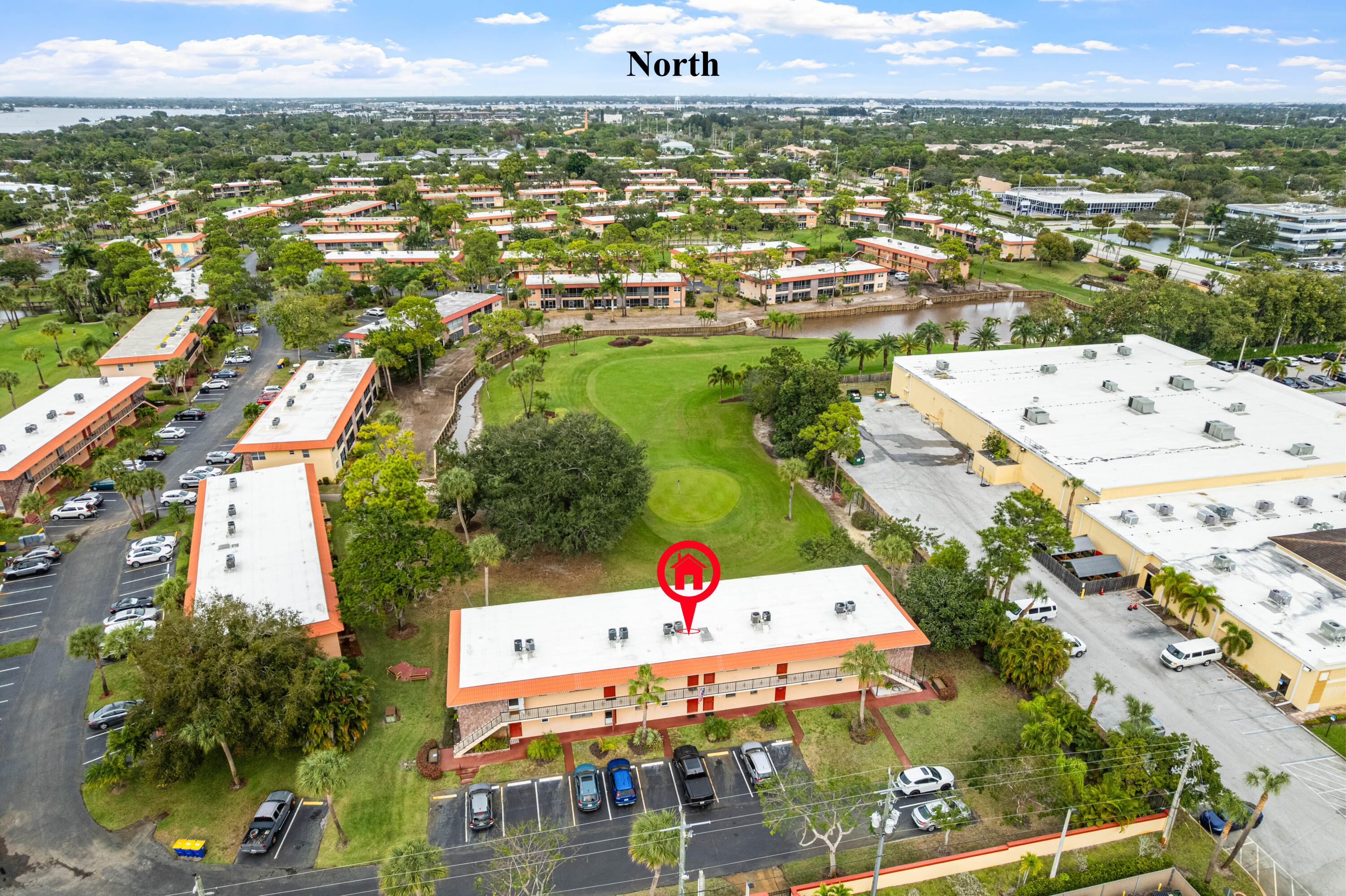 1981 Southwest Palm City Road, Unit 42H Stuart, FL 34994 - Photo 27 of 43 an aerial view of residential houses with outdoor space and trees