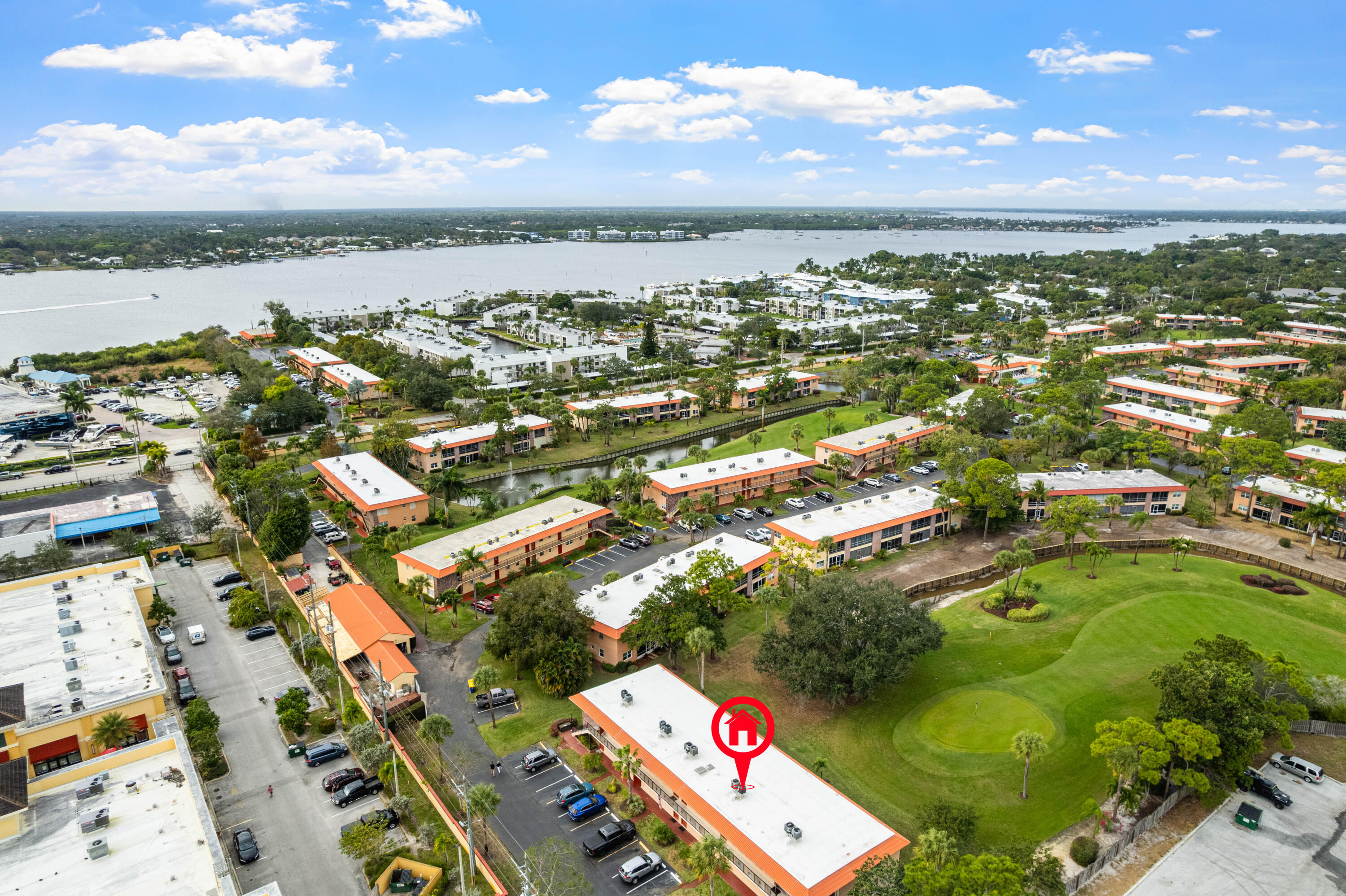 1981 Southwest Palm City Road, Unit 42H Stuart, FL 34994 - Photo 31 of 43 an aerial view of residential building with outdoor space