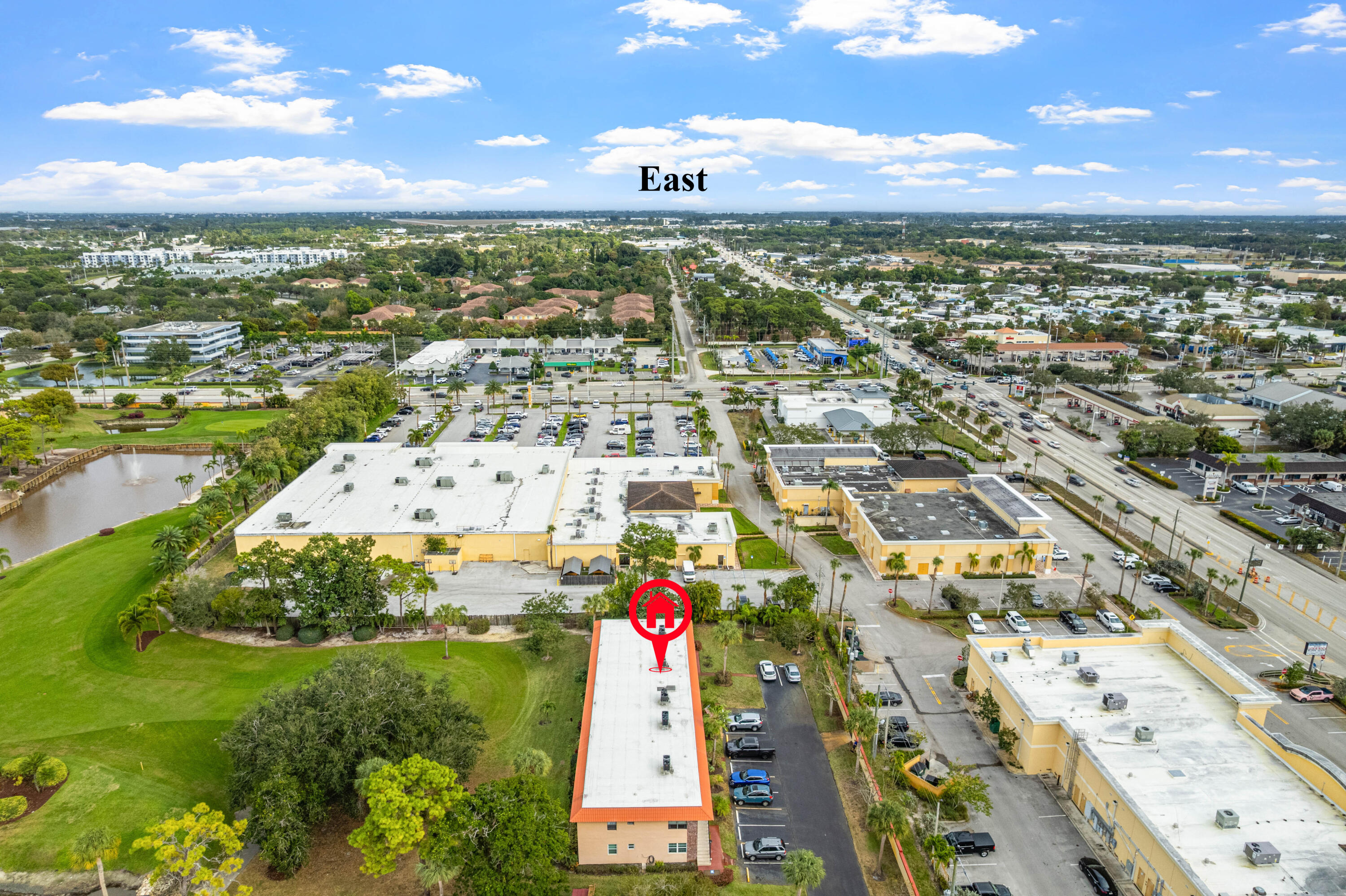 1981 Southwest Palm City Road, Unit 42H Stuart, FL 34994 - Photo 32 of 43 an aerial view of residential building and lake