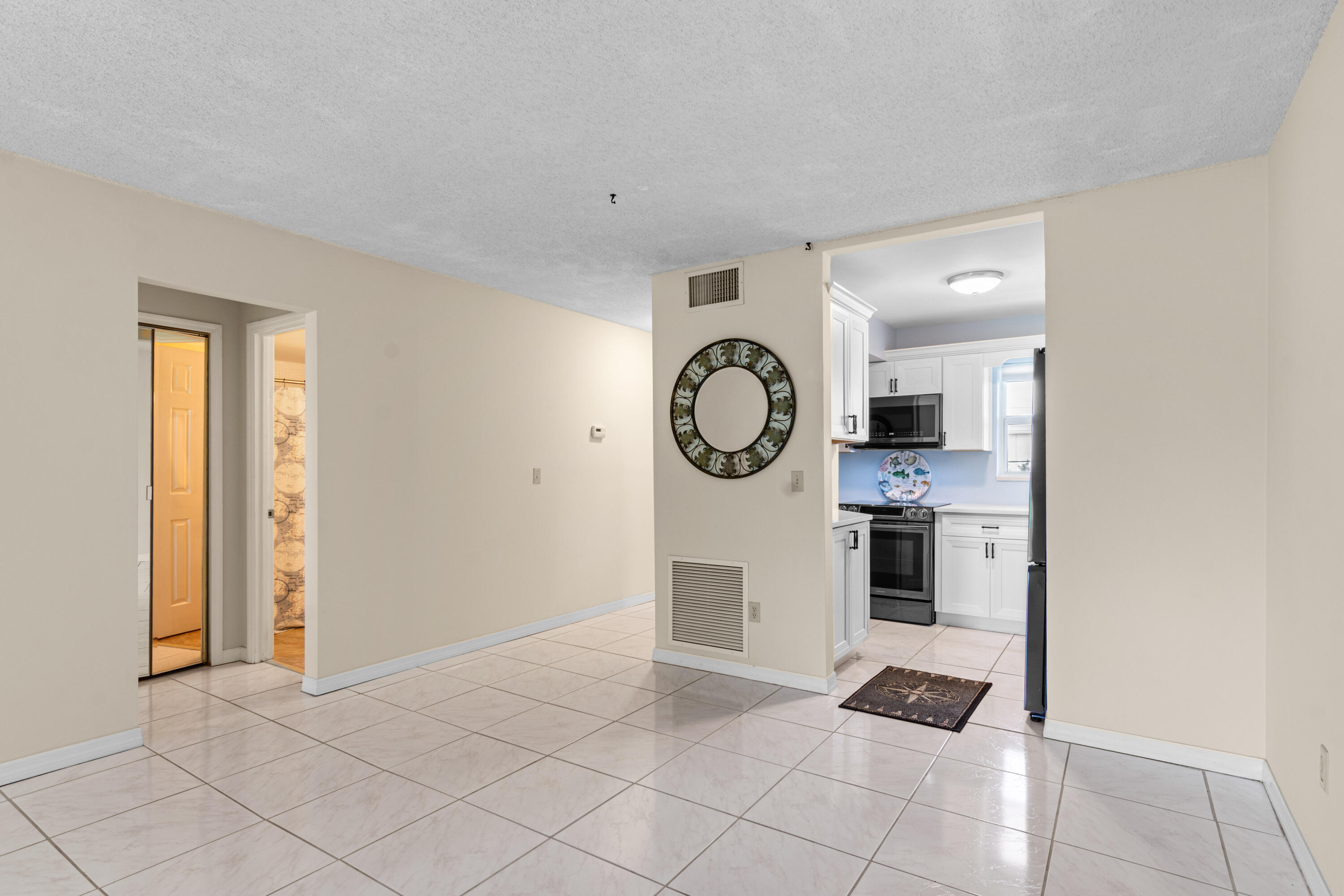 1981 Southwest Palm City Road, Unit 42H Stuart, FL 34994 - Photo 7 of 43 a view of kitchen with cabinets and window
