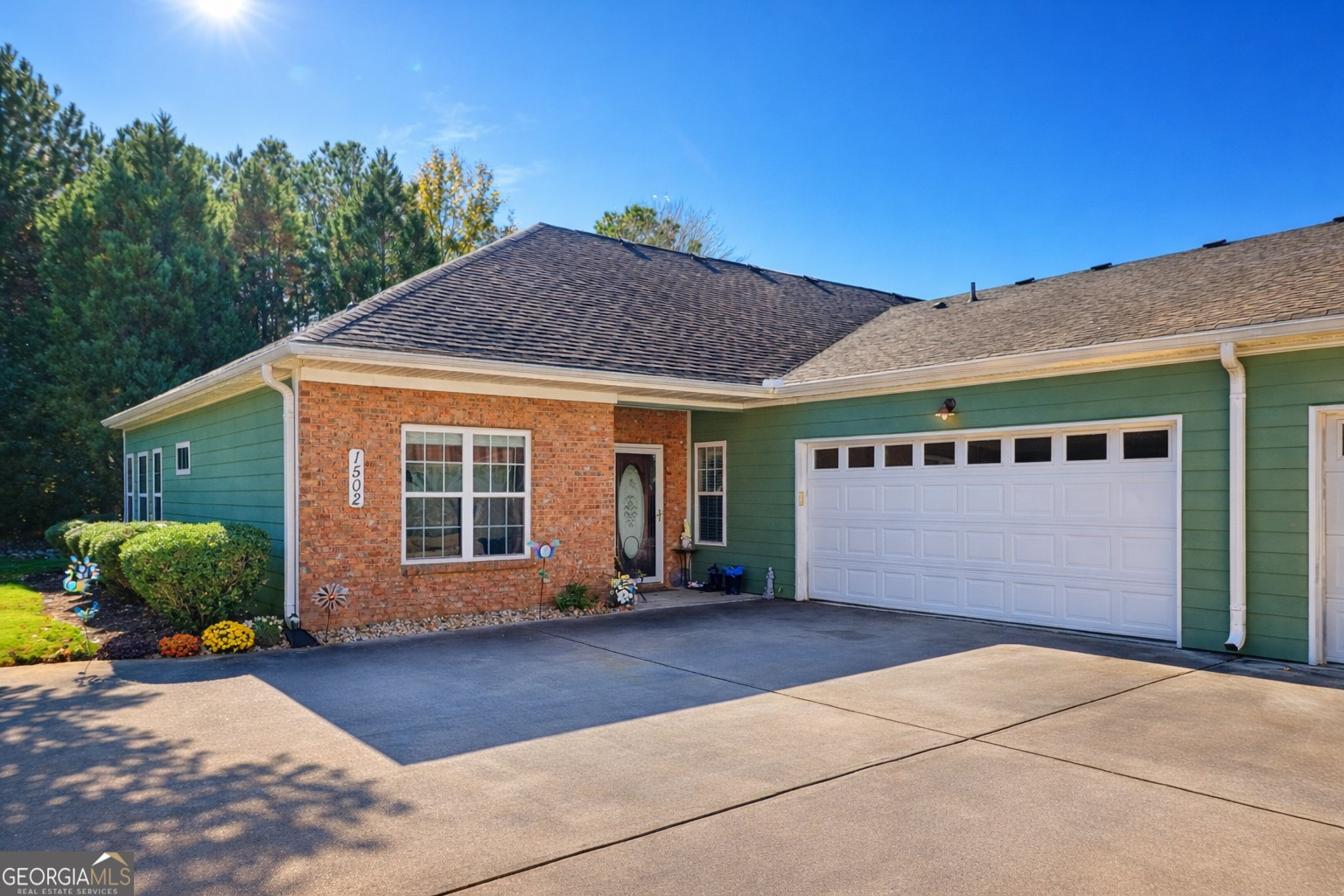 1502 Commonwealth Circle Newnan, GA 30263 - Photo 1 of 30 a front view of a house with garden