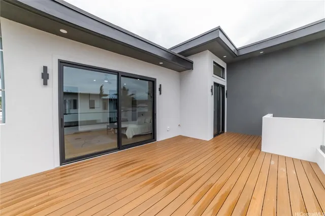 a bathroom with a granite countertop sink toilet a shower a mirror and a tub