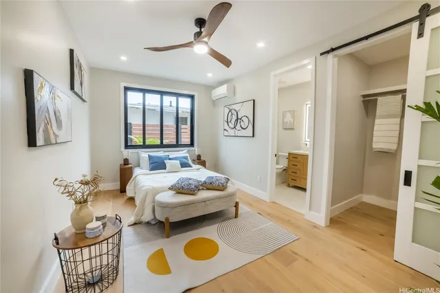 a bathroom with a double vanity sink toilet mirror and shower