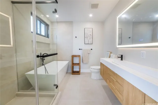 a bedroom with furniture and a large window