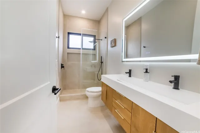 a bedroom with furniture and a large window