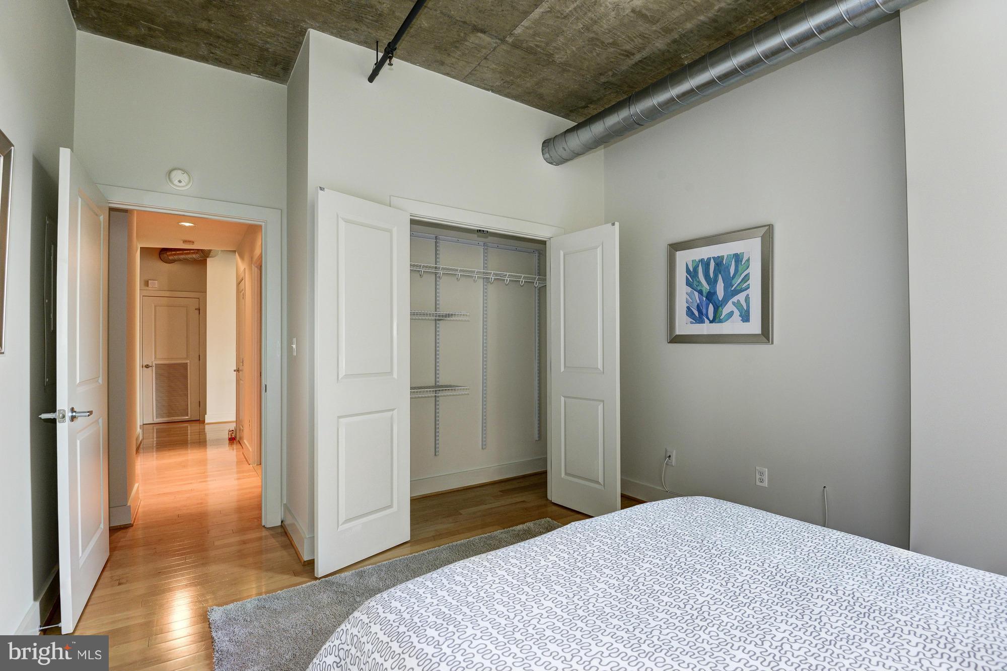 2301 Champlain Street Northwest, Unit 208 Washington, DC 20009 - Photo 22 of 30 a bedroom with a bed and a view of bathroom