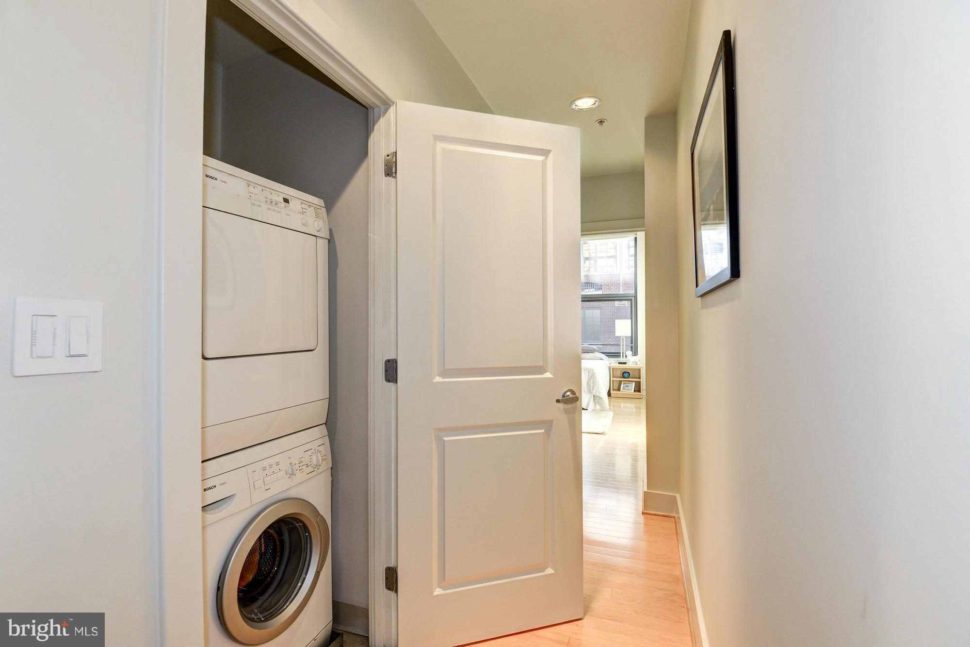 2301 Champlain Street Northwest, Unit 208 Washington, DC 20009 - Photo 24 of 30 a view of a hallway with washer and dryer