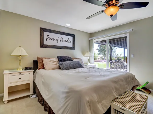 a bathroom with a sink vanity granite and a mirror