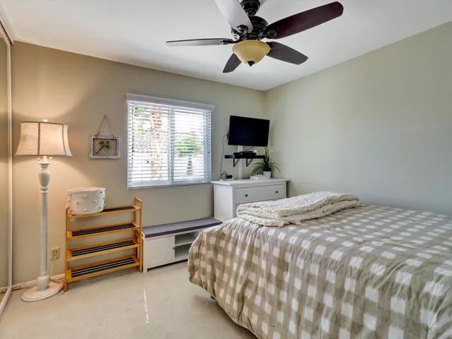 a black and white checkered floor with a white cabinet