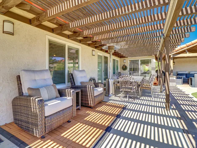 a outdoor living space with furniture and a swimming pool