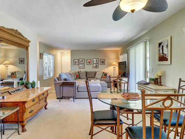 a kitchen with stainless steel appliances granite countertop a refrigerator stove and sink
