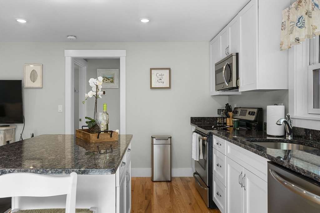 4 Hye Lane Edgartown, MA 02539 - Photo 26 of 41 a kitchen with stainless steel appliances granite countertop a sink stove and cabinets