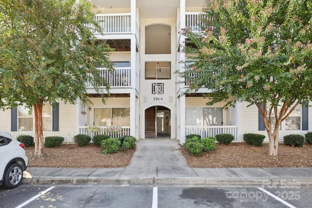 a front view of a building with garden