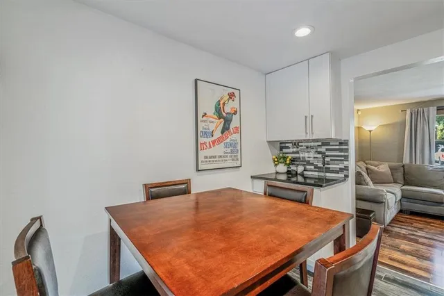 a kitchen with stainless steel appliances kitchen island wooden cabinets and stove top oven