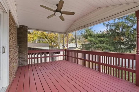 a view of a porch with wooden floor