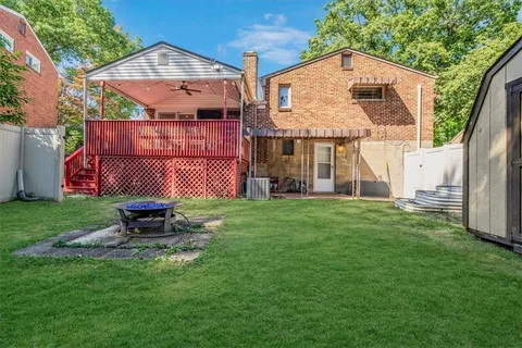 a front view of house with yard and outdoor seating