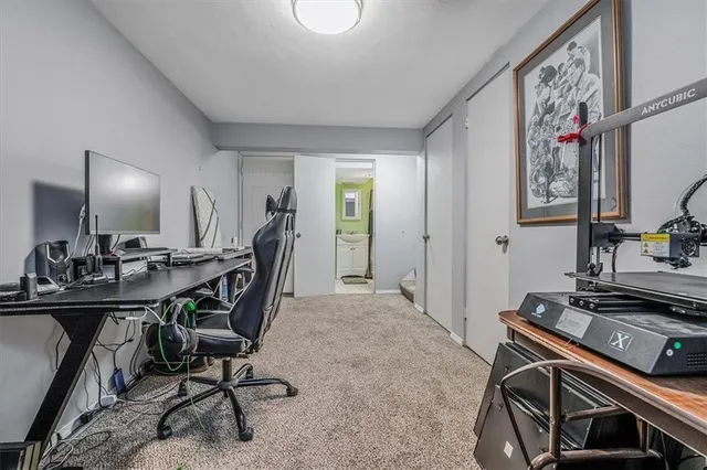 a view of a workspace with furniture