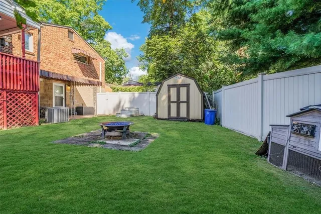 a view of a backyard with sitting area