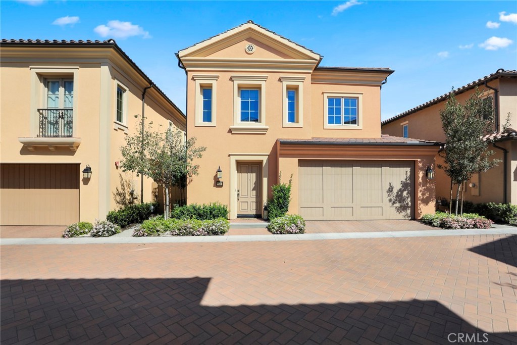 100 Brindisi Irvine, CA 92618 - Photo 1 of 1 a front view of a house with a yard and garage