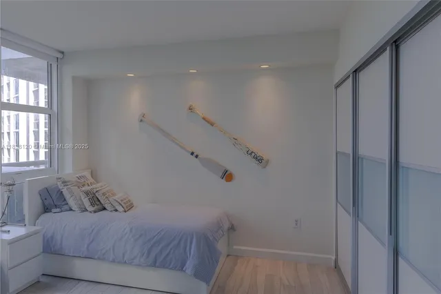 a living room with furniture and large windows