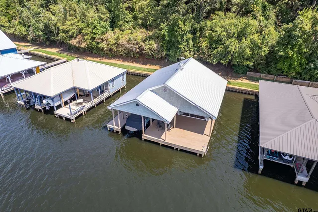 an aerial view of a house having patio