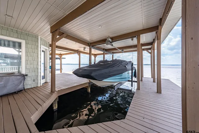 a view of outdoor space with wooden floor