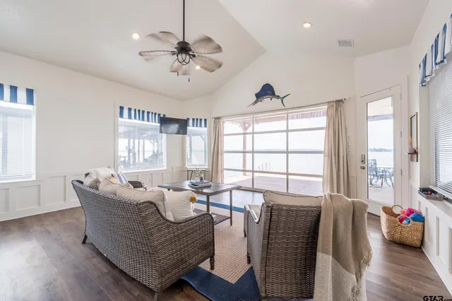 a living room with furniture and windows