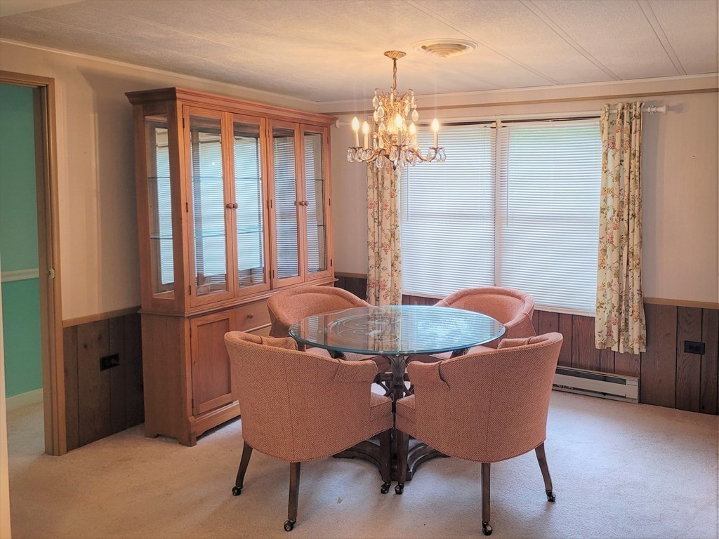62 Longboat Road Wareham, MA 02576 - Photo 11 of 32 a view of a dining room with furniture window and wooden floor