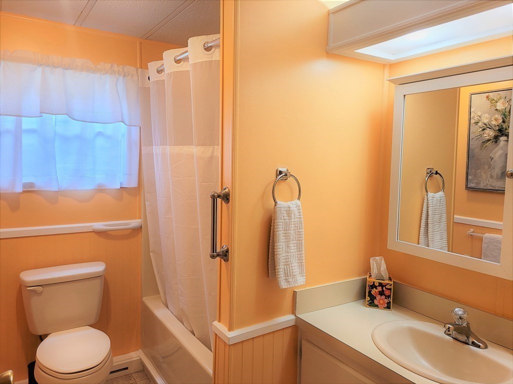 62 Longboat Road Wareham, MA 02576 - Photo 12 of 32 a bathroom with a sink a toilet and shower