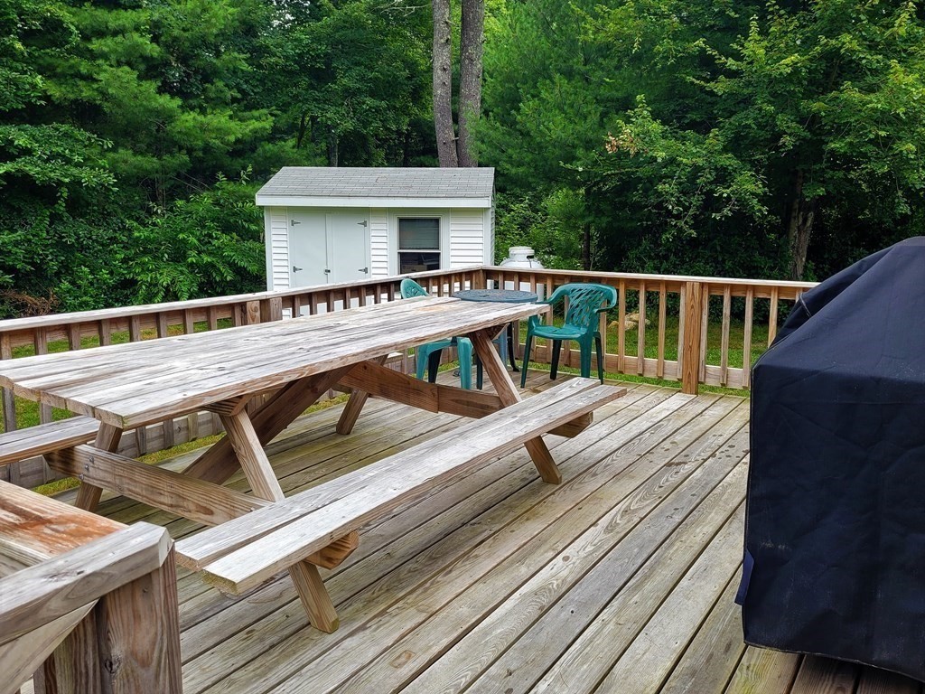 62 Longboat Road Wareham, MA 02576 - Photo 25 of 32 a view of a roof deck with wooden floor and fence