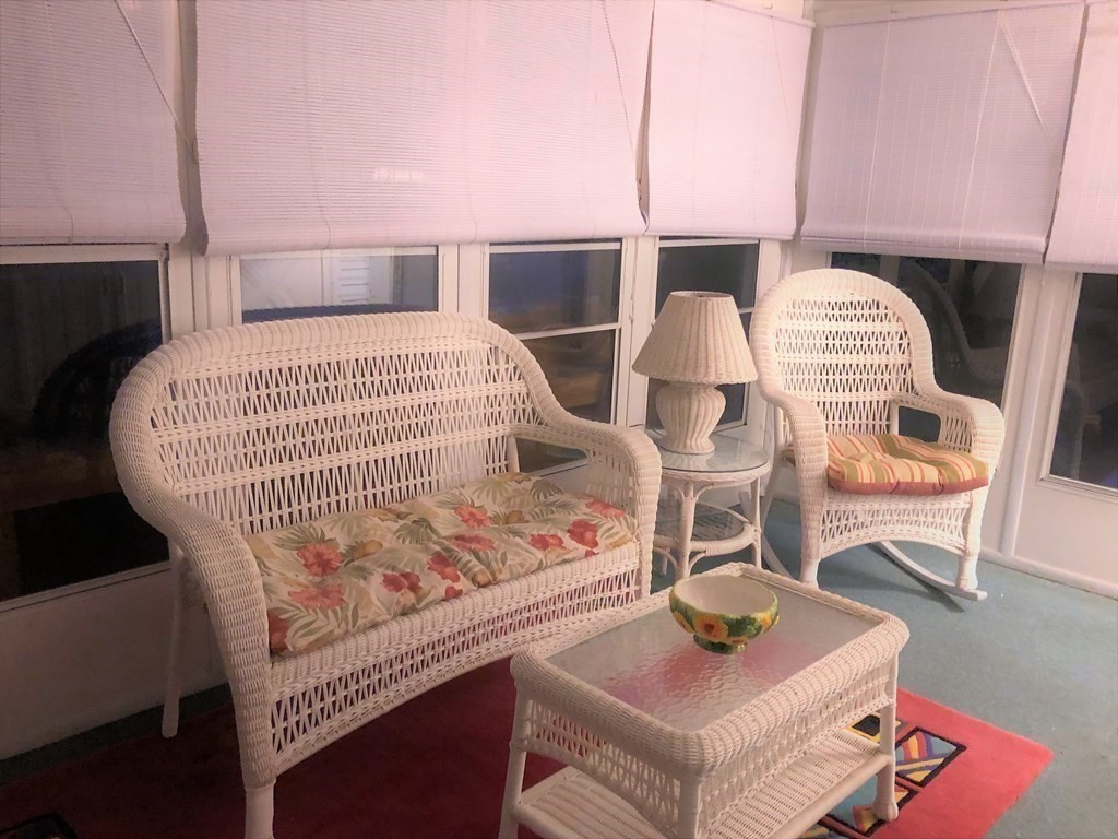 62 Longboat Road Wareham, MA 02576 - Photo 29 of 32 a bedroom with a bed and wooden floor