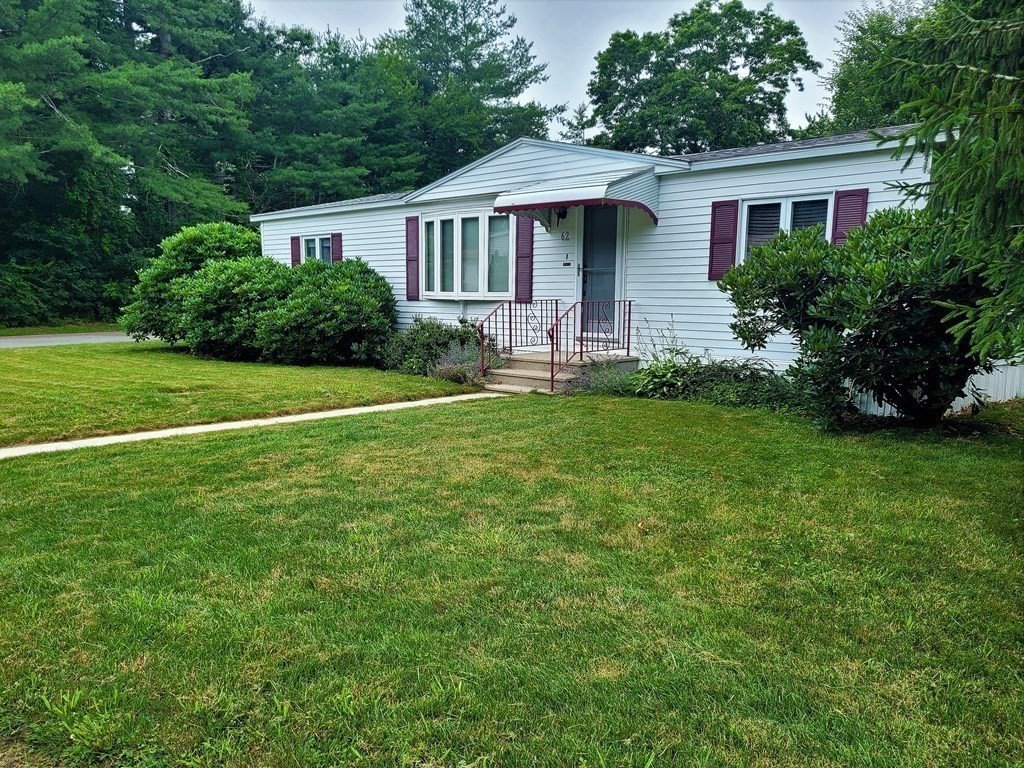 62 Longboat Road Wareham, MA 02576 - Photo 3 of 32 a front view of a house with a garden