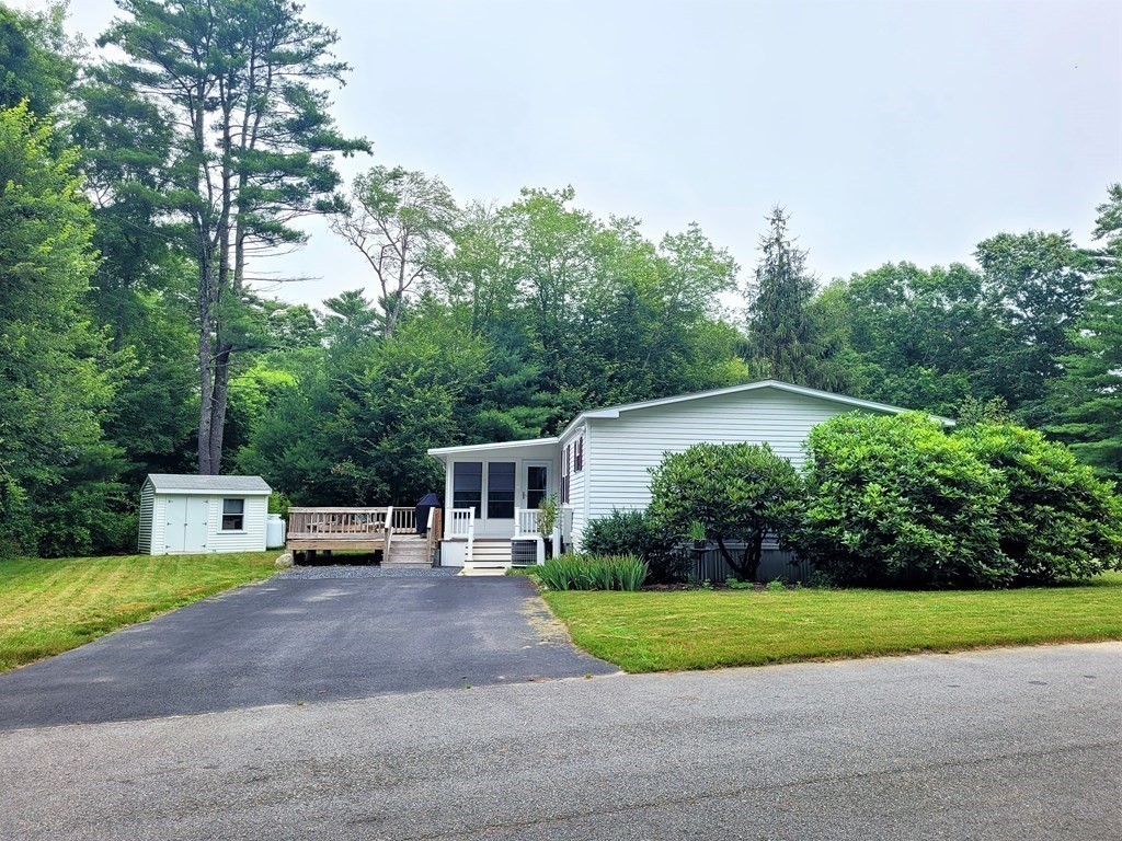 62 Longboat Road Wareham, MA 02576 - Photo 4 of 32 a house view with a garden space