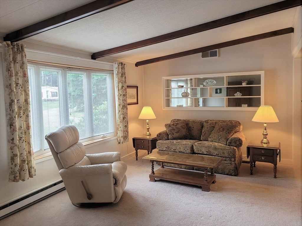62 Longboat Road Wareham, MA 02576 - Photo 5 of 32 a living room with furniture and a large window