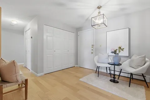 a view of room with furniture and wooden floor