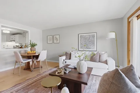 a living room with furniture and a table