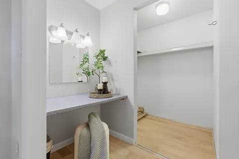 a view of kitchen with cabinets and wooden floor